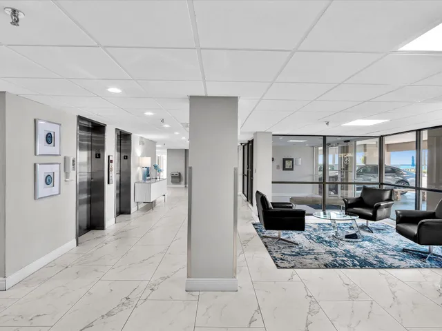 a living room with furniture windows and wooden floor