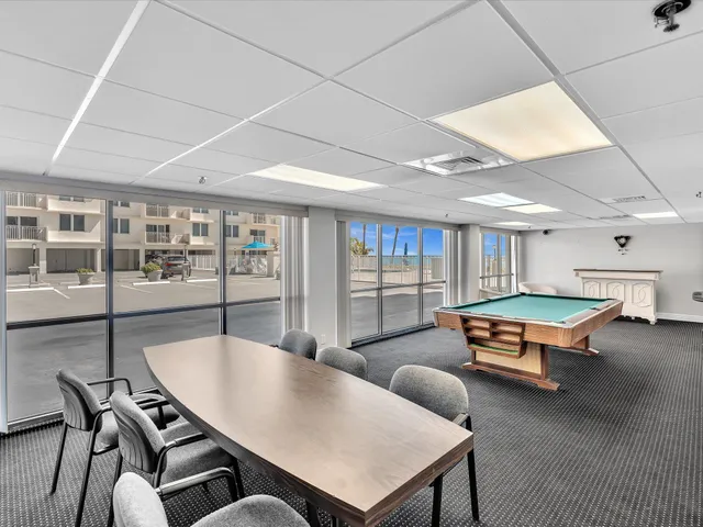 a view of a dining hall with furniture