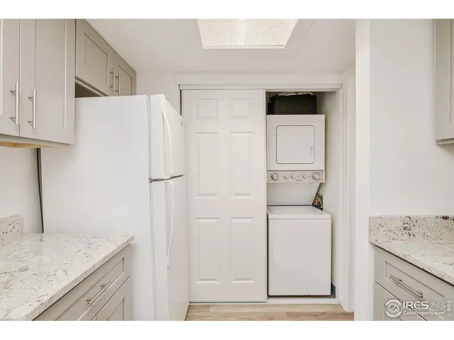 a kitchen with a sink a cabinetry and refrigerator