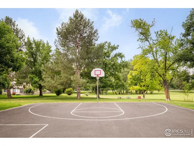 a sign board with a trees in the background