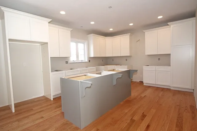 a view of kitchen with wooden floor