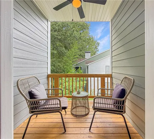 a view of a balcony with furniture
