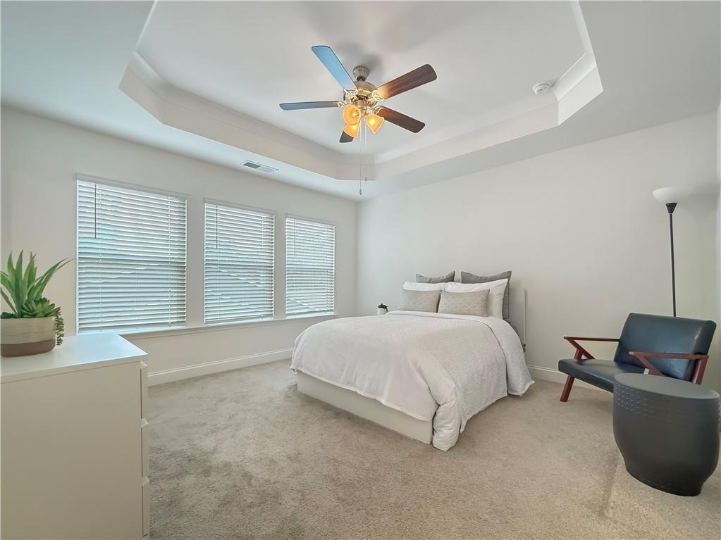 1160 Kendron Lane, Unit 16 Atlanta, GA 30329 - Photo 18 of 39 a bedroom with a bed and a potted plant