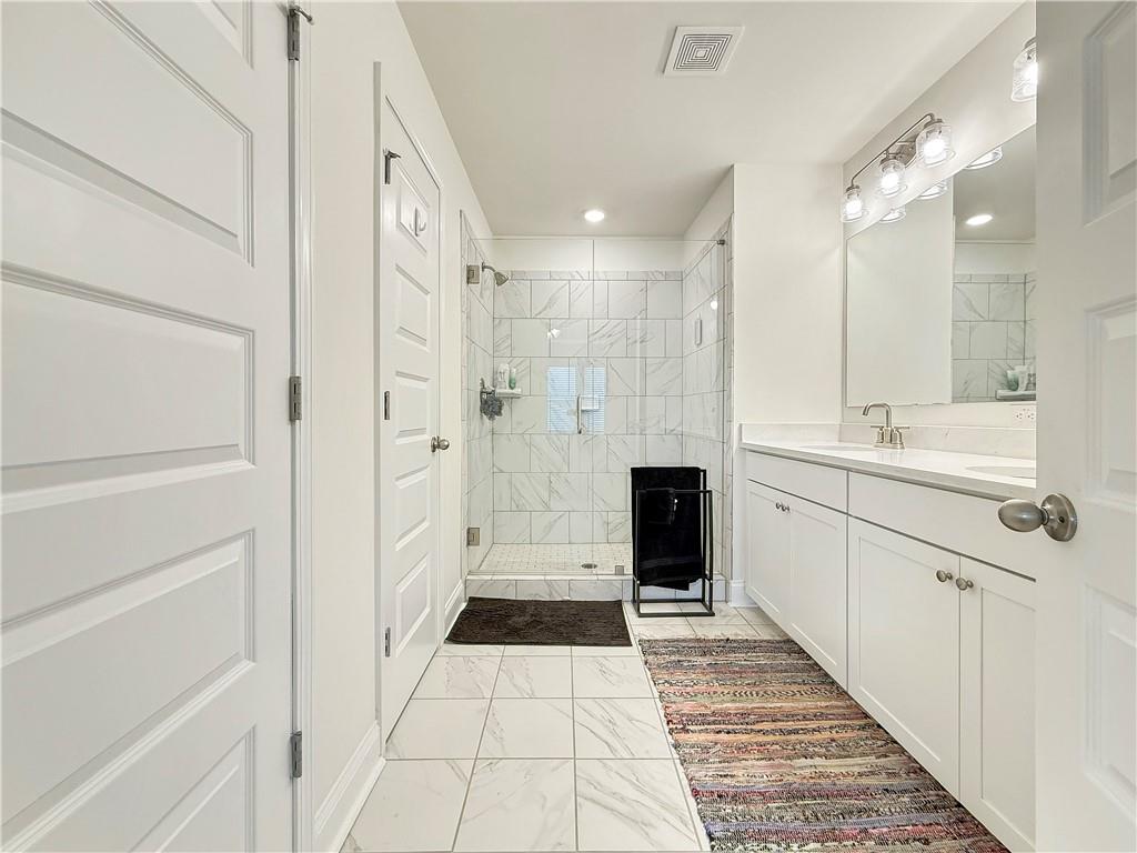 1160 Kendron Lane, Unit 16 Atlanta, GA 30329 - Photo 22 of 39 a bathroom with a sink a toilet a mirror and shower