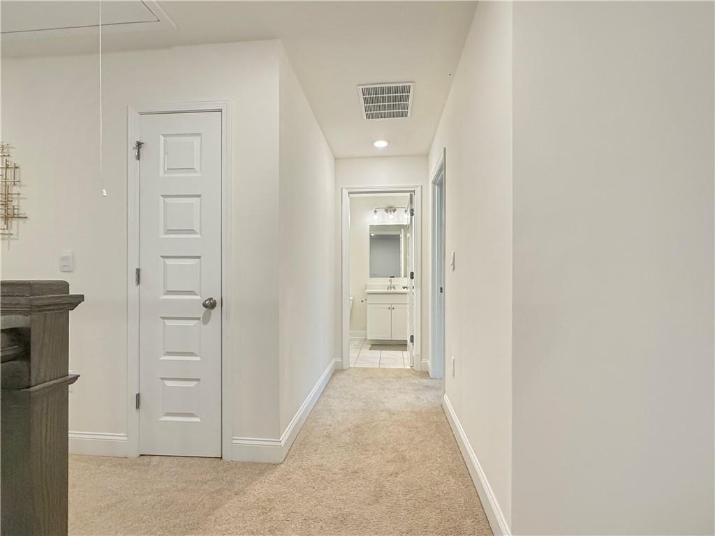 1160 Kendron Lane, Unit 16 Atlanta, GA 30329 - Photo 29 of 39 a view of a hallway with closet and wooden floor