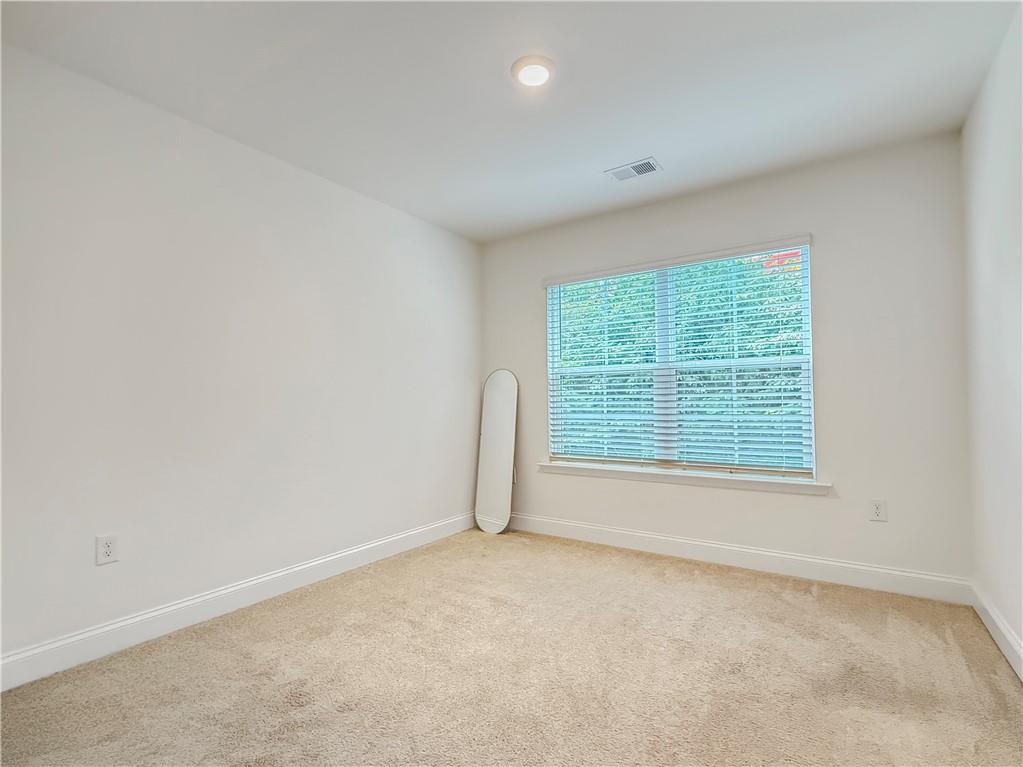 1160 Kendron Lane, Unit 16 Atlanta, GA 30329 - Photo 31 of 39 an empty room with a window