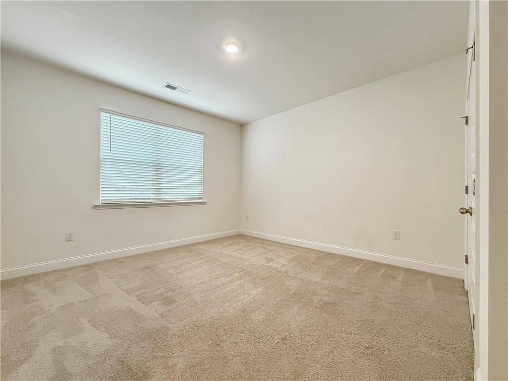 1160 Kendron Lane, Unit 16 Atlanta, GA 30329 - Photo 36 of 39 an empty room with a window
