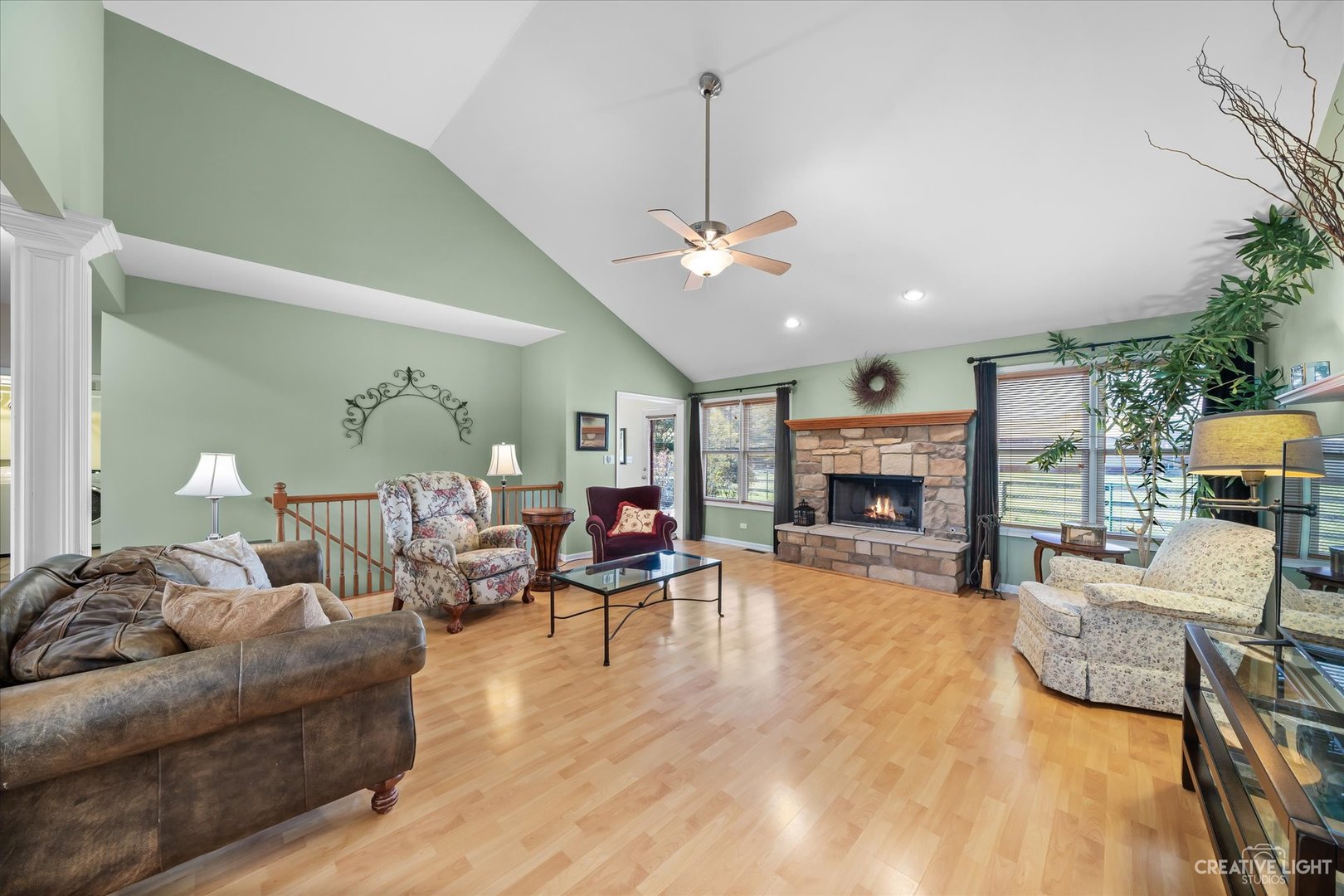 8N440 McGough Road Maple Park, IL 60151 - Photo 3 of 35 a living room with furniture a fireplace and a potted plant