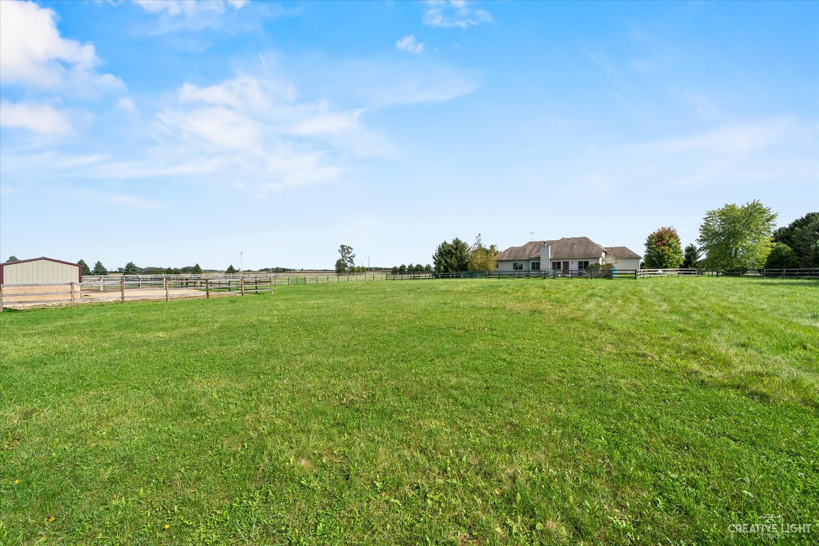 8N440 McGough Road Maple Park, IL 60151 - Photo 29 of 35 a backyard of a house with lots of green space and fog