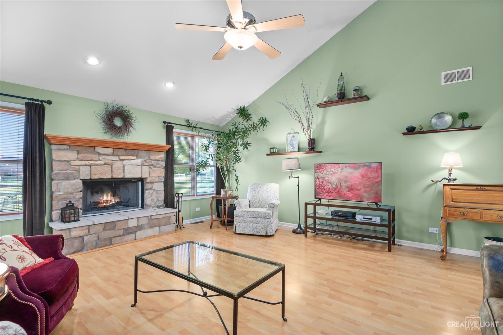 8N440 McGough Road Maple Park, IL 60151 - Photo 5 of 35 a living room with furniture a flat screen tv and a fireplace