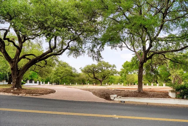 a view of street with houses and trees