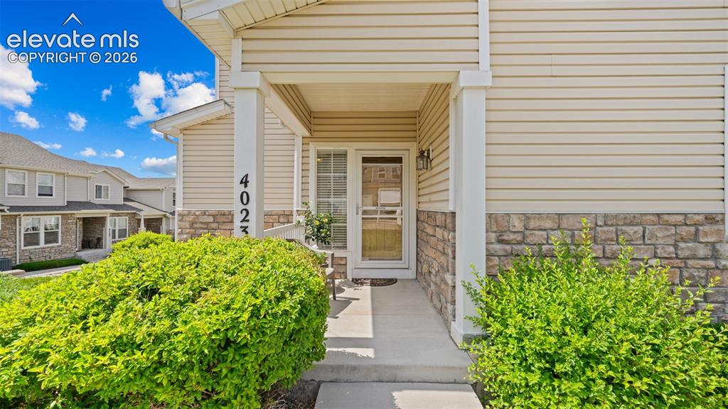 4023 Diamond Ridge View Colorado Springs, CO 80918 - Photo 2 of 31 a view of a house with potted plants