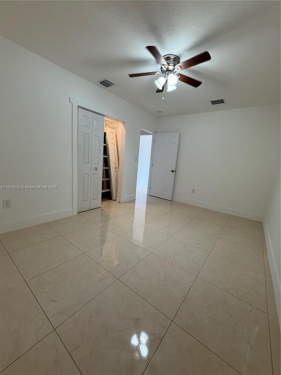 Flagami Miami, FL 33144 - Photo 12 of 20 a view of an empty room with a ceiling fan