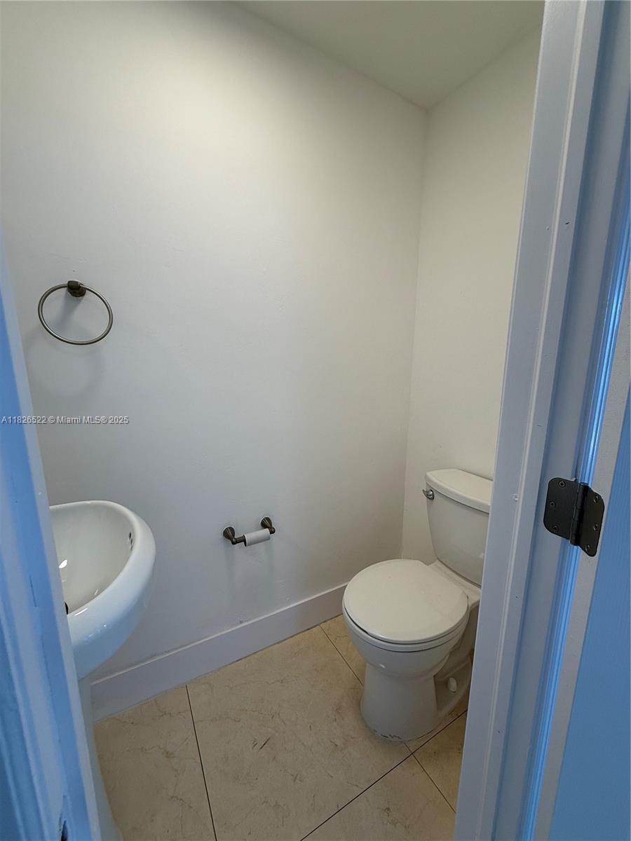 Flagami Miami, FL 33144 - Photo 18 of 20 a white toilet sitting next to a shower