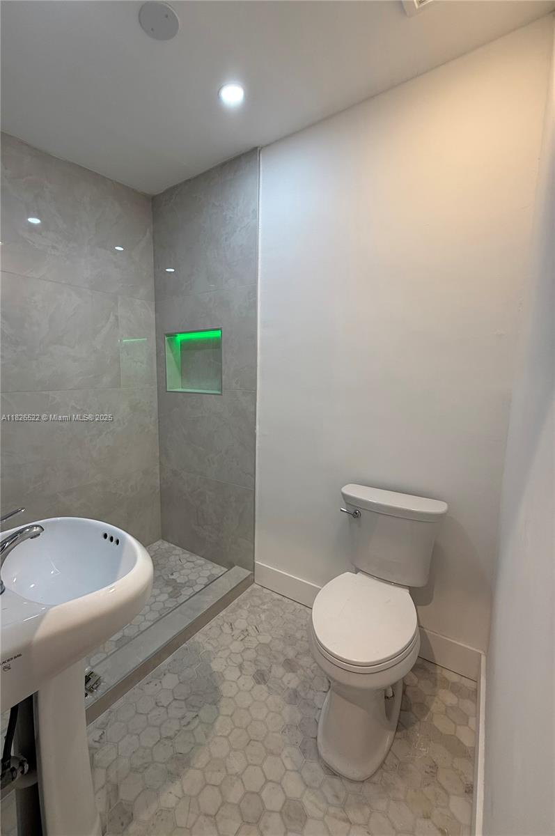 Flagami Miami, FL 33144 - Photo 8 of 20 a bathroom with a toilet and a sink