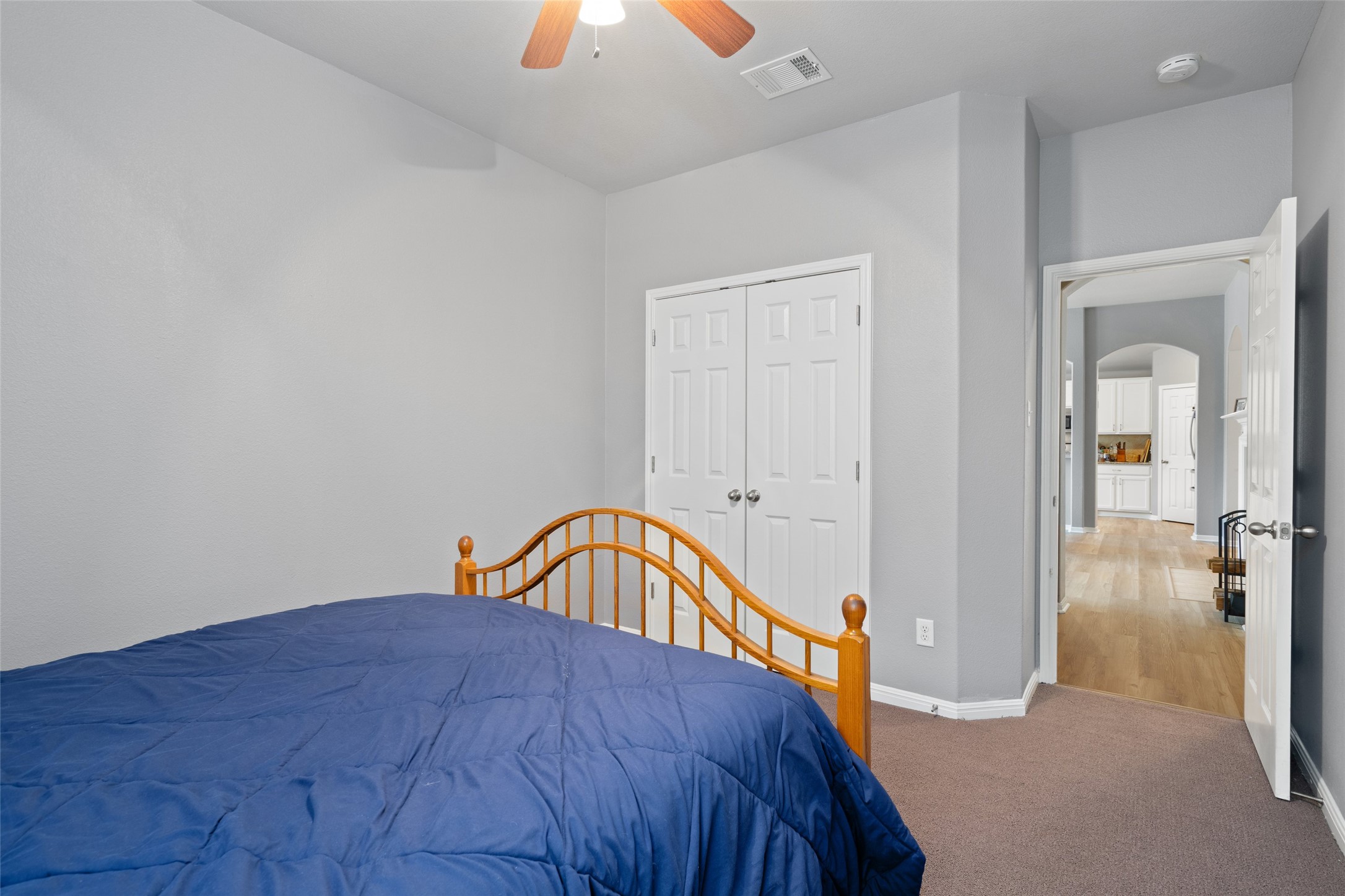 7013 Cromarty Lane Austin, TX 78754 - Photo 26 of 37 This room features a ceiling fan, closet with bifold doors, and carpet flooring