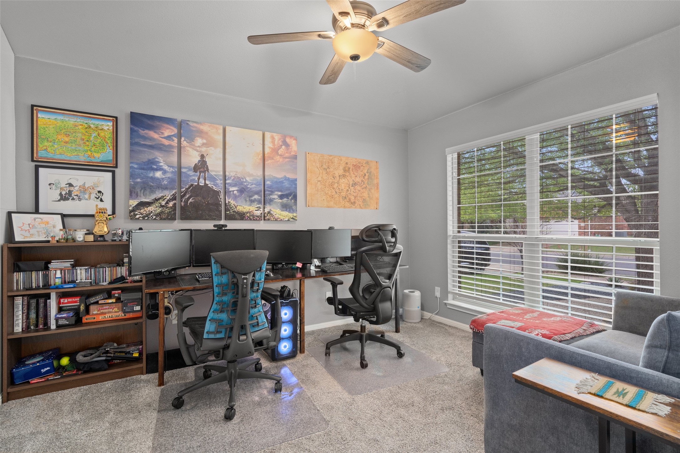 7013 Cromarty Lane Austin, TX 78754 - Photo 8 of 37 This room features light grey walls and carpeted flooring, complemented by a ceiling fan with integrated lighting