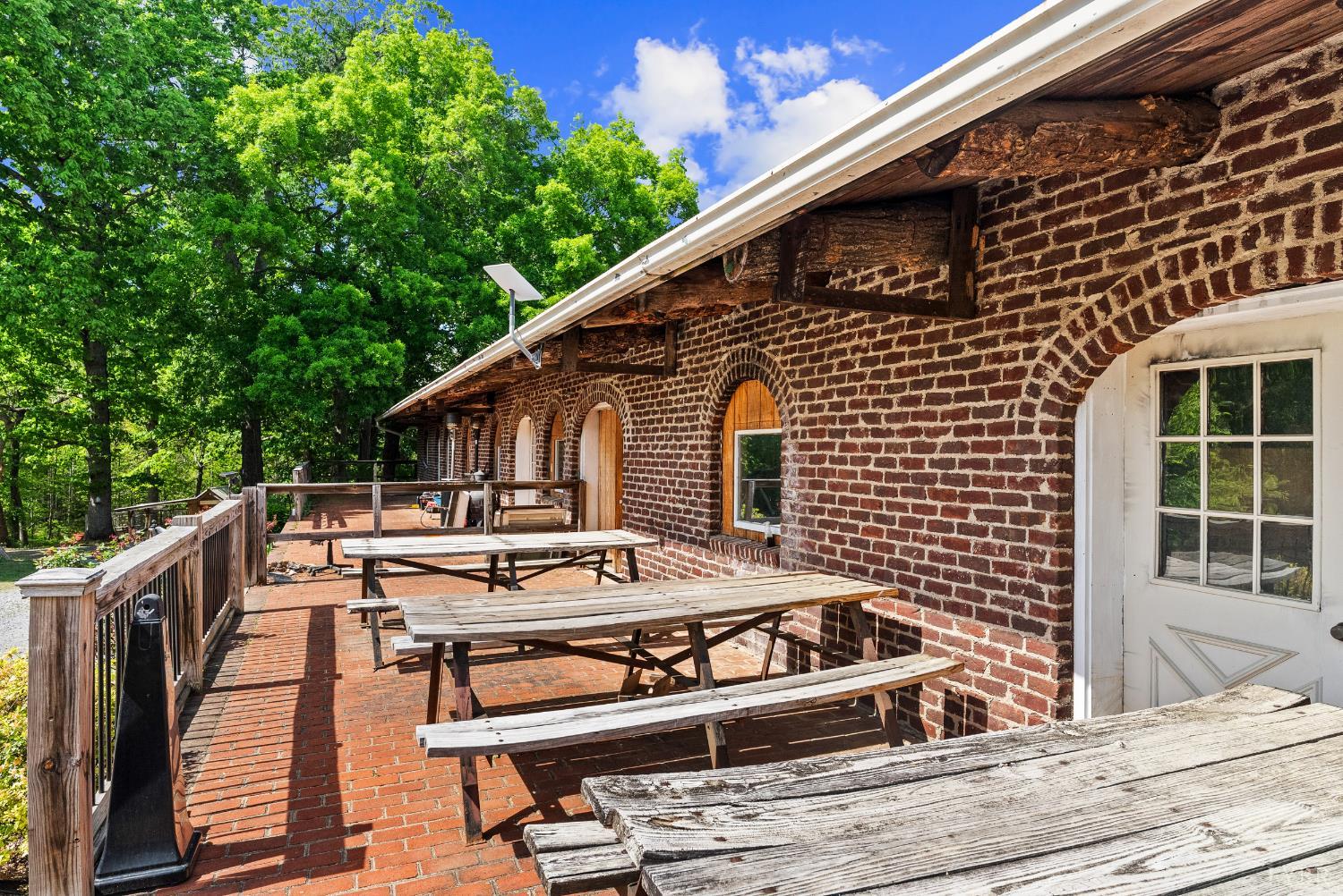 4067 Dickerson Mill Road Bedford, VA 24523 - Photo 5 of 90 a view of a roof deck with couches and wooden floor