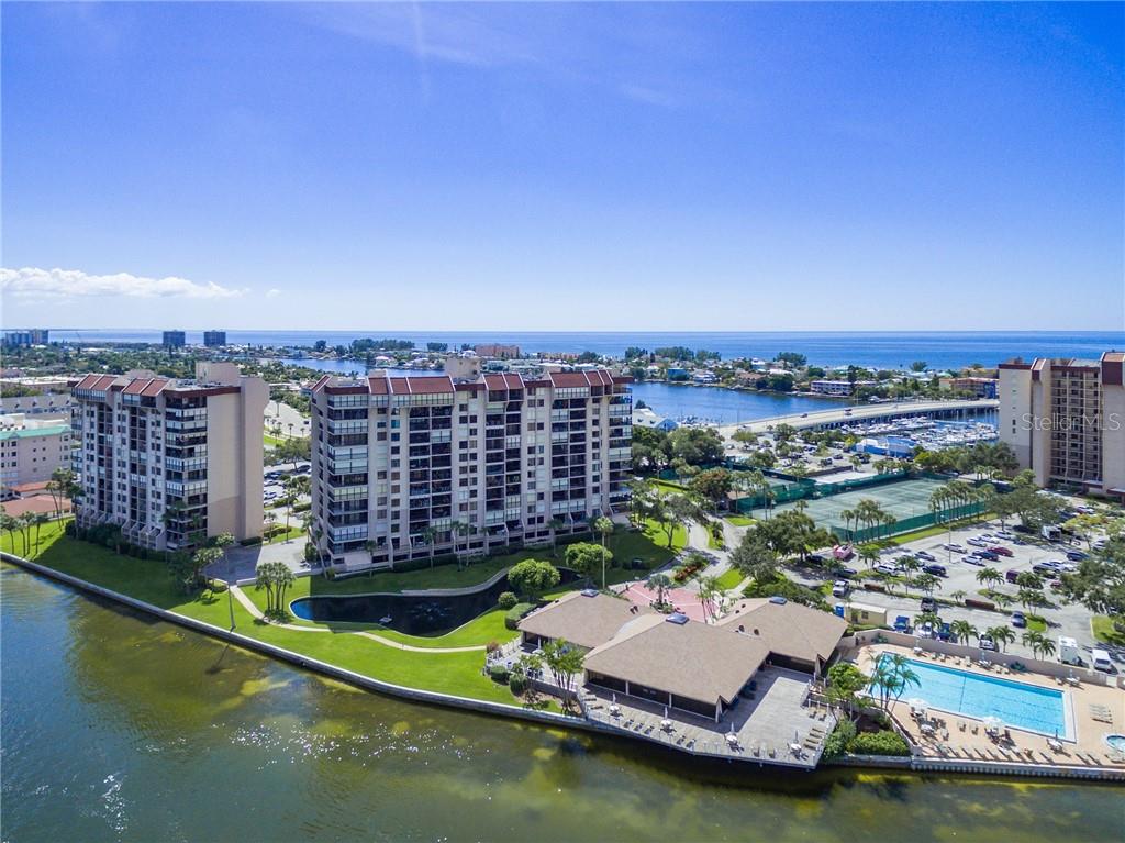 9415 Blind Pass Road, Unit 204 St. Pete Beach, FL 33706 - Photo 1 of 1 YTC aerial view with Weatherly building to the left