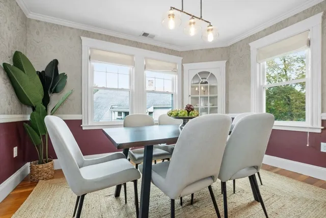 a view of a dining room with furniture window and outside view