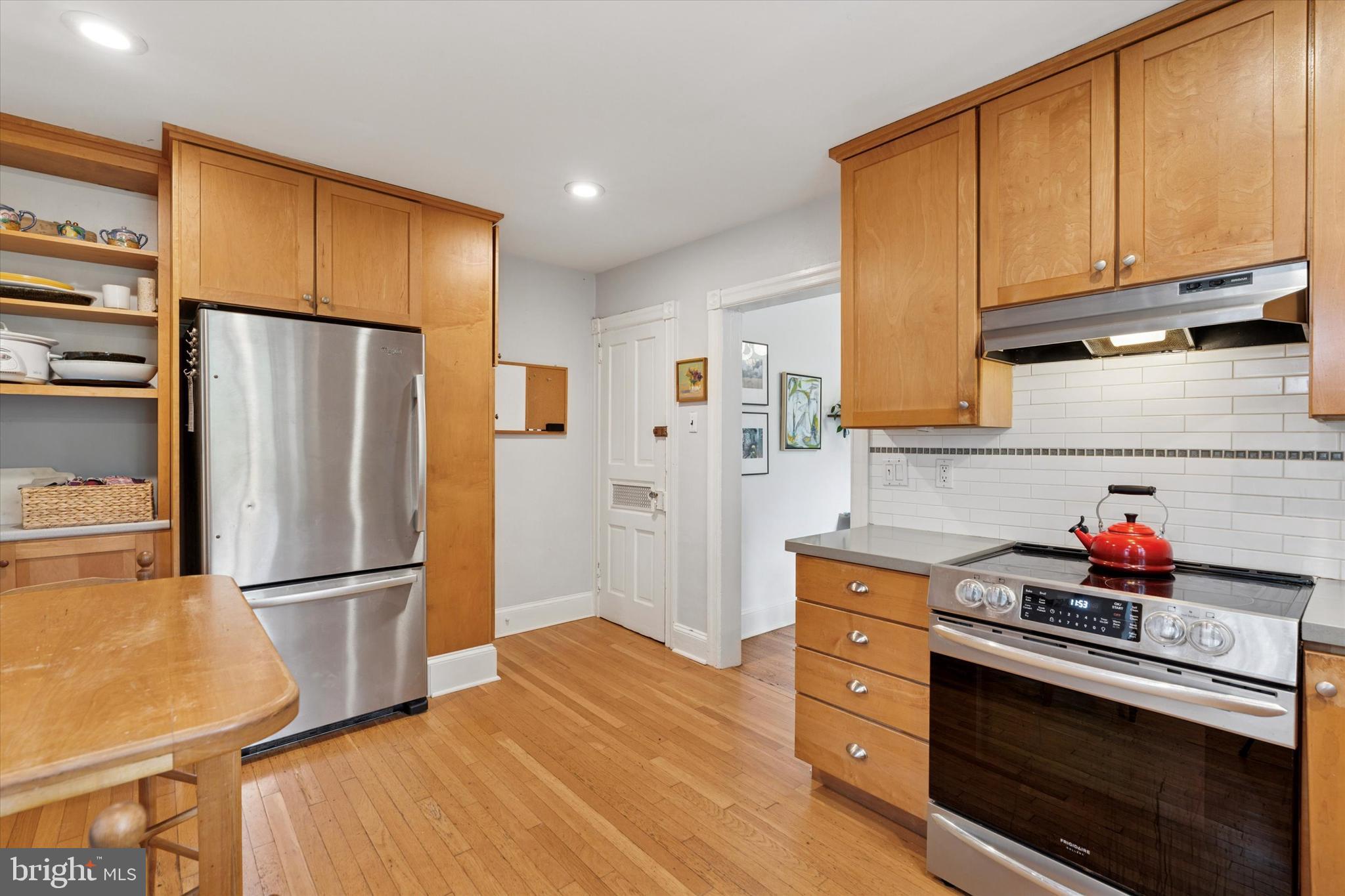 156 Idris Road Merion Station, PA 19066 - Photo 12 of 33 a kitchen with stainless steel appliances a refrigerator sink and cabinets