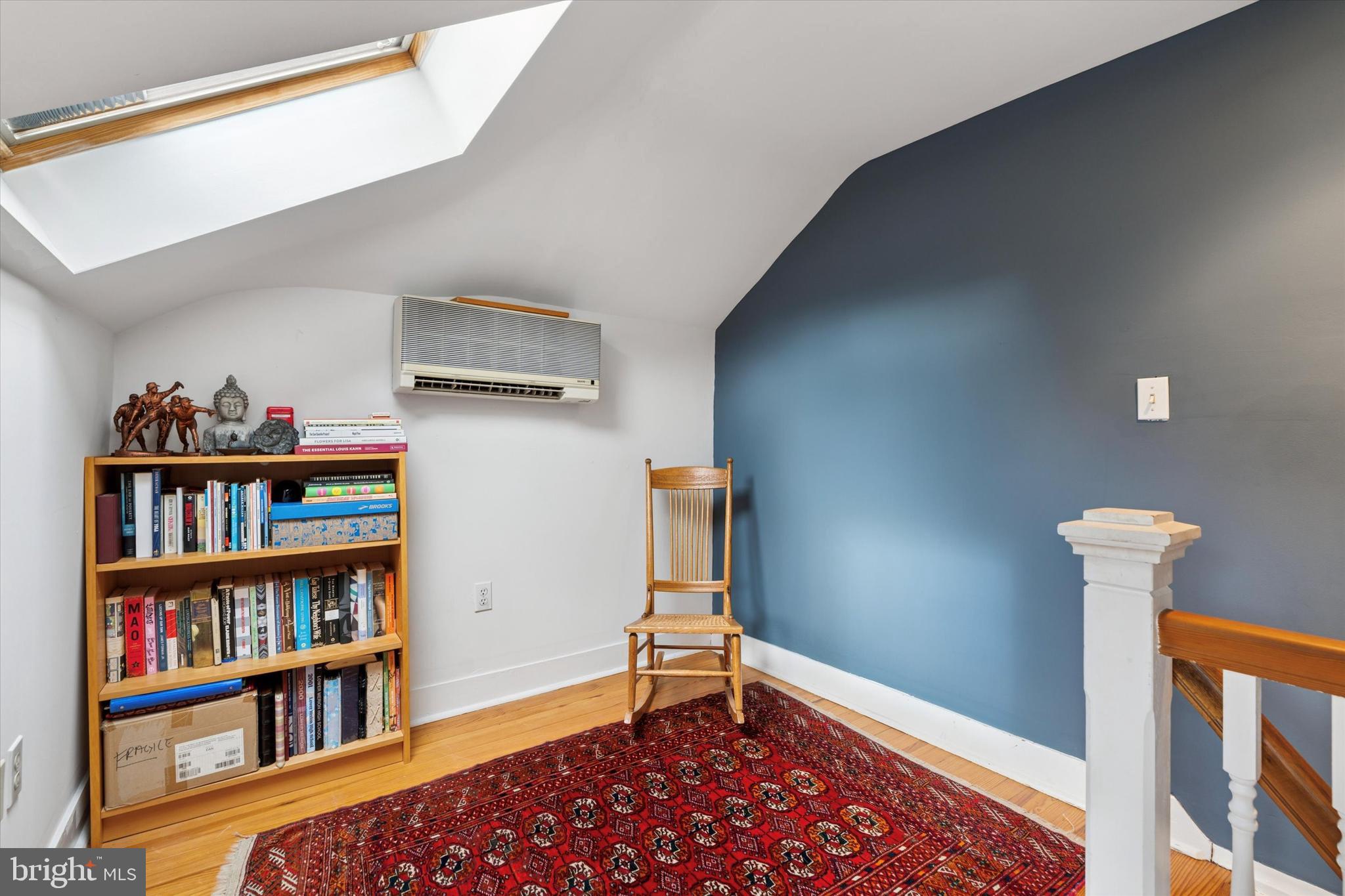 156 Idris Road Merion Station, PA 19066 - Photo 26 of 33 a room with book shelf and a wooden floor