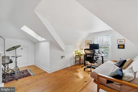 a view of a workspace with furniture and a workspace