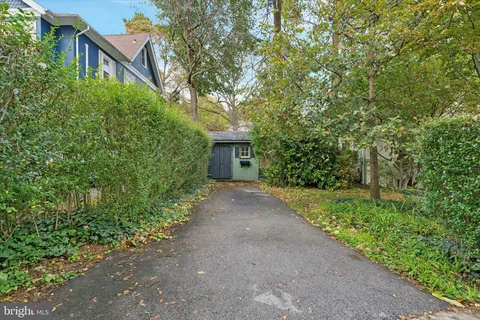 a view of a house with a tree