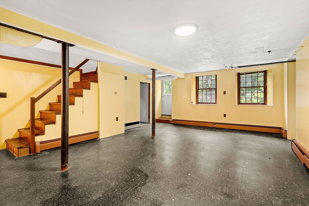 390 Central Avenue Milton, MA 02186 - Photo 28 of 33 a view of an empty room with a window