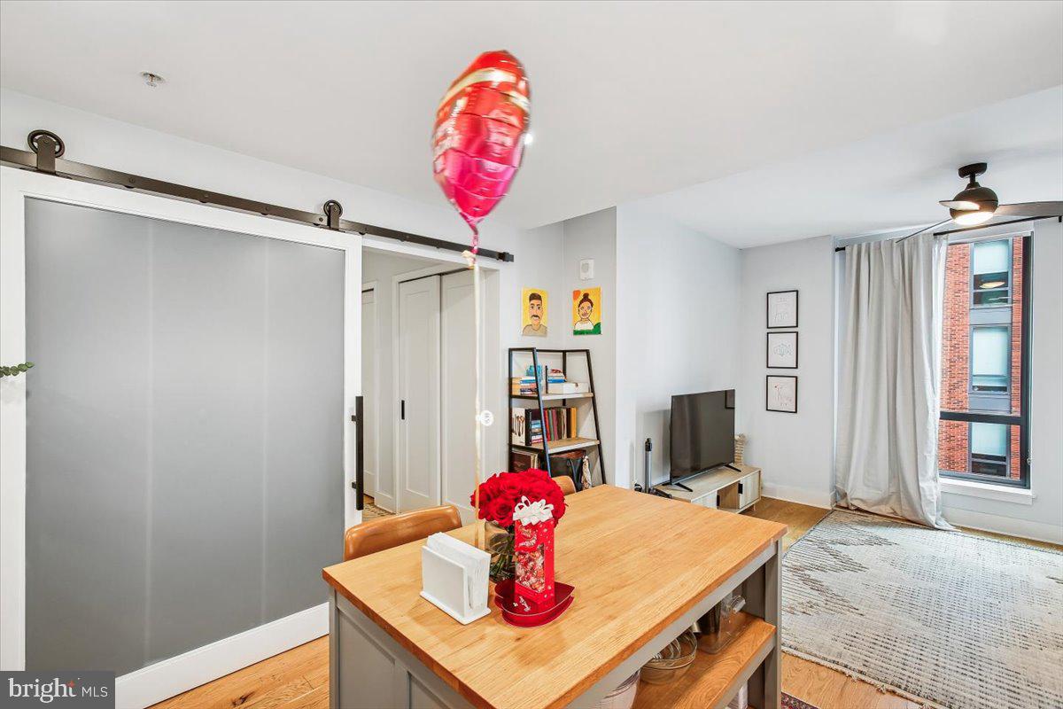 1211 Van Street Southeast, Unit 902 Washington, DC 20003 - Photo 11 of 43 a view of a dining room with furniture and chandelier