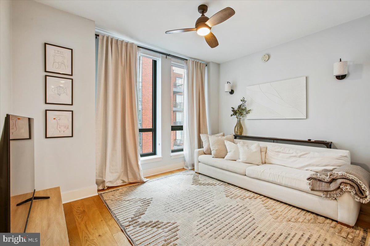1211 Van Street Southeast, Unit 902 Washington, DC 20003 - Photo 22 of 43 a spacious bedroom with a bed and a chandelier