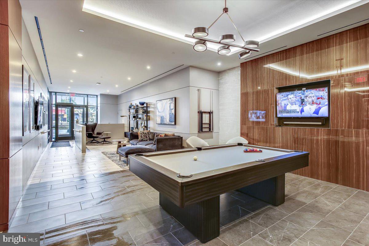 1211 Van Street Southeast, Unit 902 Washington, DC 20003 - Photo 23 of 43 a room with pool table and a chandelier
