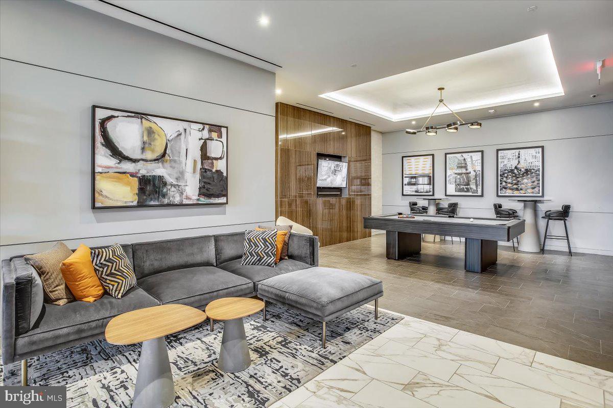 1211 Van Street Southeast, Unit 902 Washington, DC 20003 - Photo 24 of 43 a living room with furniture and a large window