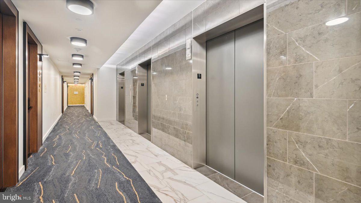 1211 Van Street Southeast, Unit 902 Washington, DC 20003 - Photo 30 of 43 a bathroom with a glass door shower
