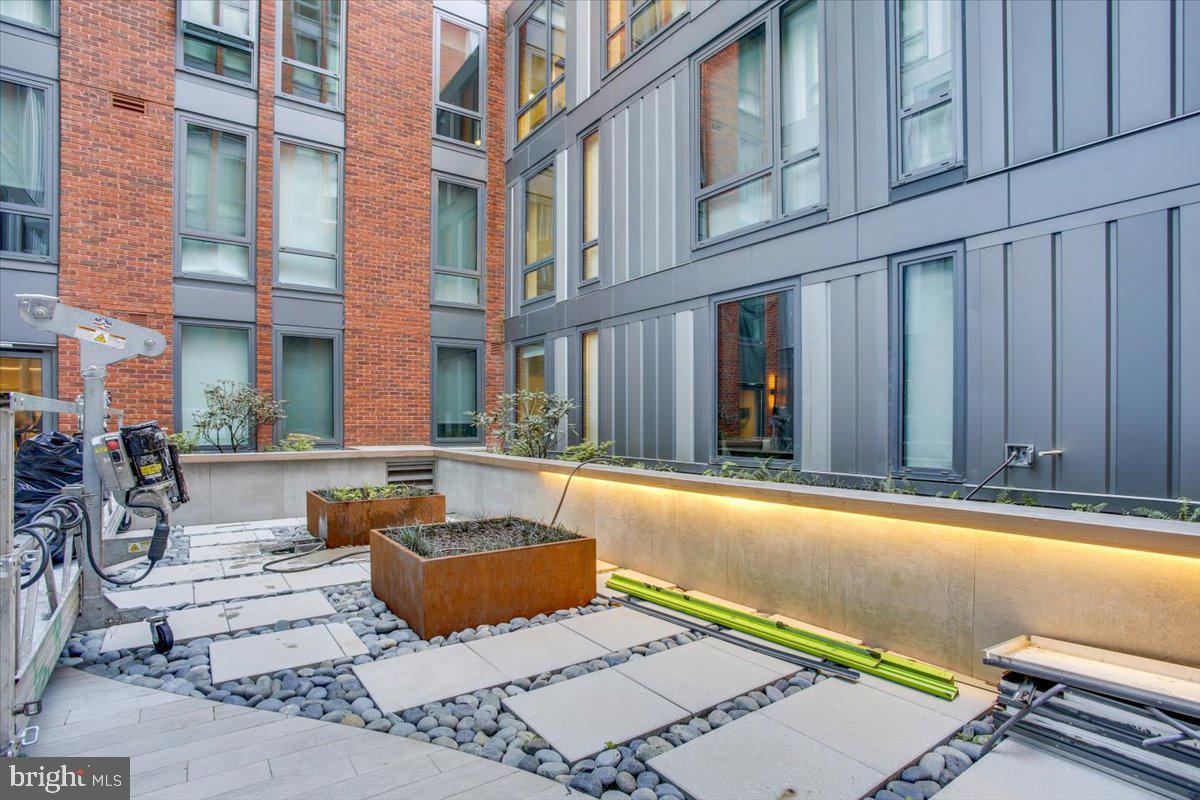 1211 Van Street Southeast, Unit 902 Washington, DC 20003 - Photo 42 of 43 a backyard of a house with outdoor seating
