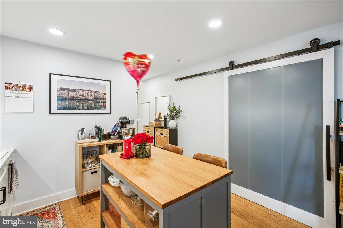 1211 Van Street Southeast, Unit 902 Washington, DC 20003 - Photo 9 of 43 a room with a table and workspace