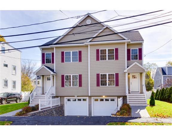23 Mott Street, Unit 1 Arlington, MA 02474 - Photo 1 of 28 a front view of a house with garden