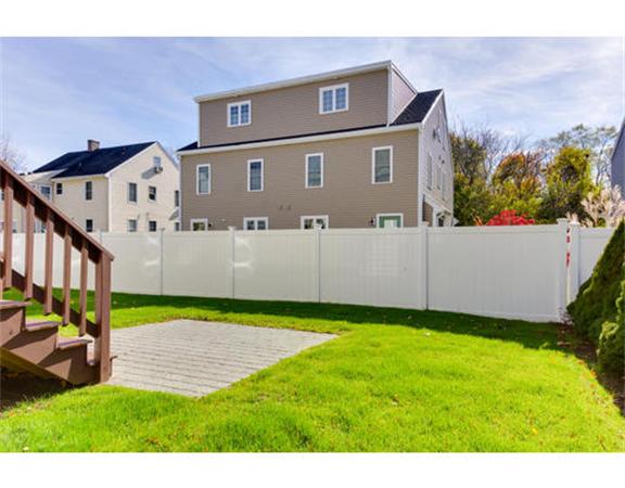 23 Mott Street, Unit 1 Arlington, MA 02474 - Photo 2 of 28 a view of an house with backyard and a tree