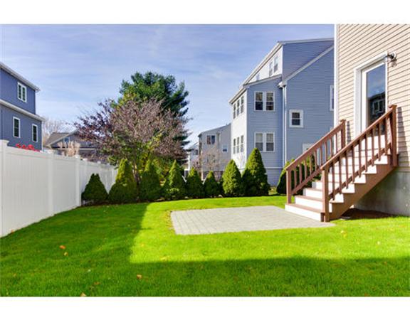 23 Mott Street, Unit 1 Arlington, MA 02474 - Photo 26 of 28 a view of a house with a yard