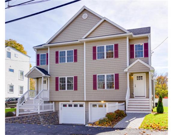 23 Mott Street, Unit 1 Arlington, MA 02474 - Photo 28 of 28 a front view of a house with a yard