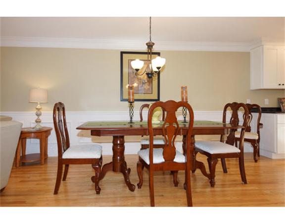 23 Mott Street, Unit 1 Arlington, MA 02474 - Photo 6 of 28 a view of a dining room with furniture and wooden floor