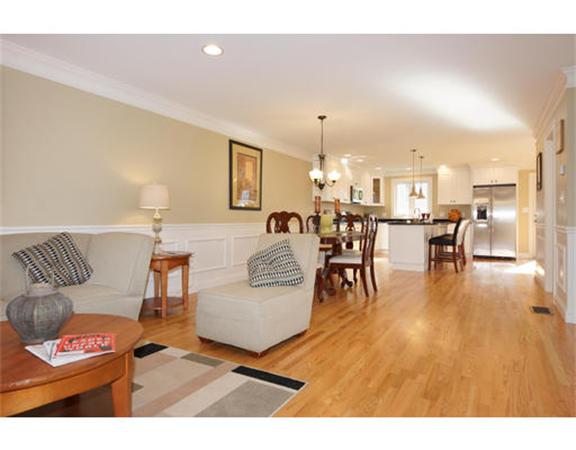 23 Mott Street, Unit 1 Arlington, MA 02474 - Photo 9 of 28 a living room with furniture and a table with wooden floor