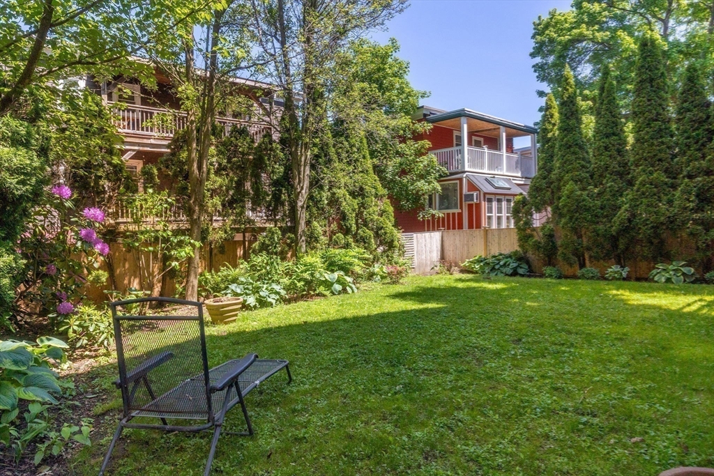 99 Upland Road Cambridge, MA 02140 - Photo 12 of 16 a backyard of a house with table and chairs