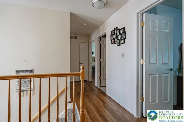 a spacious bedroom with a bed and a couch