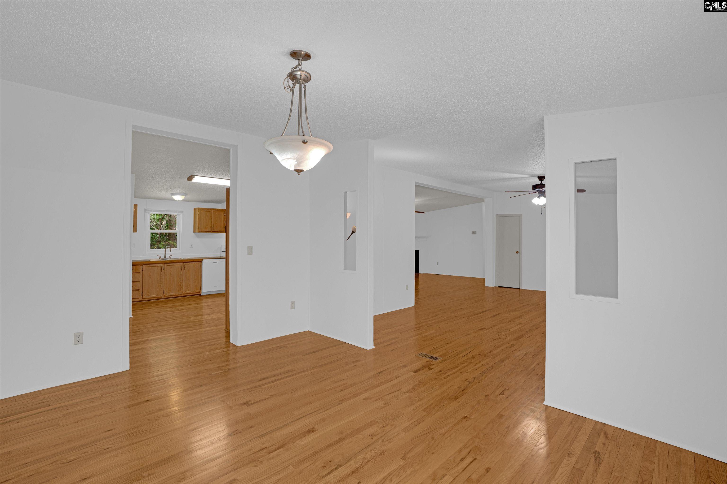 304 Cooper Road Blythewood, SC 29016 - Photo 13 of 29 a view of empty room with wooden floor