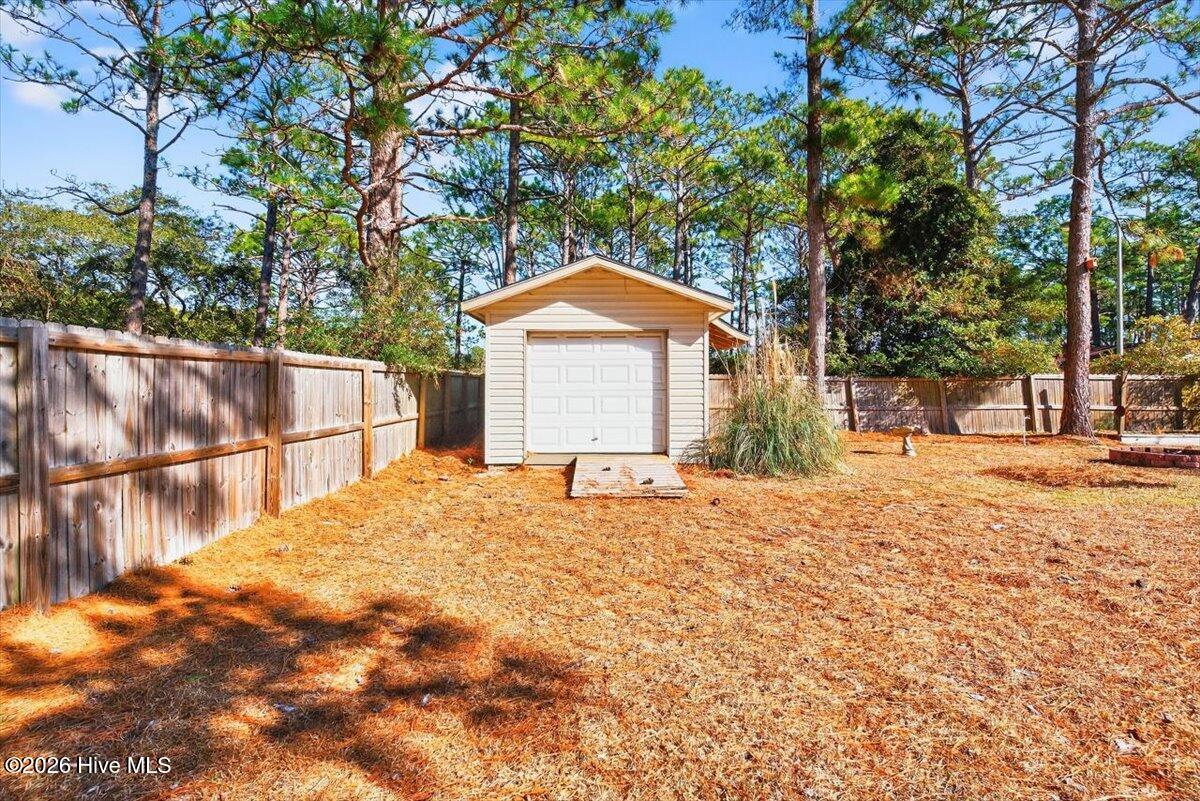 18 Brierwood Road Southwest Shallotte, NC 28470 - Photo 47 of 70 Detached storage building—perfect for tools, hobbies, or additional workspace.