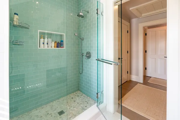 a bathroom with a shower and a sink