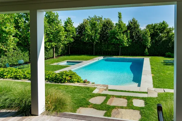 a view of a swimming pool with a yard