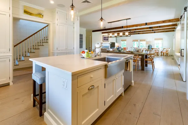 a kitchen with stove and cabinets