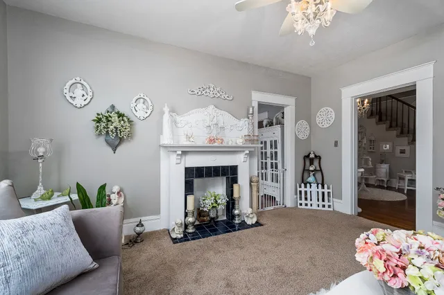 a living room with furniture and a fireplace